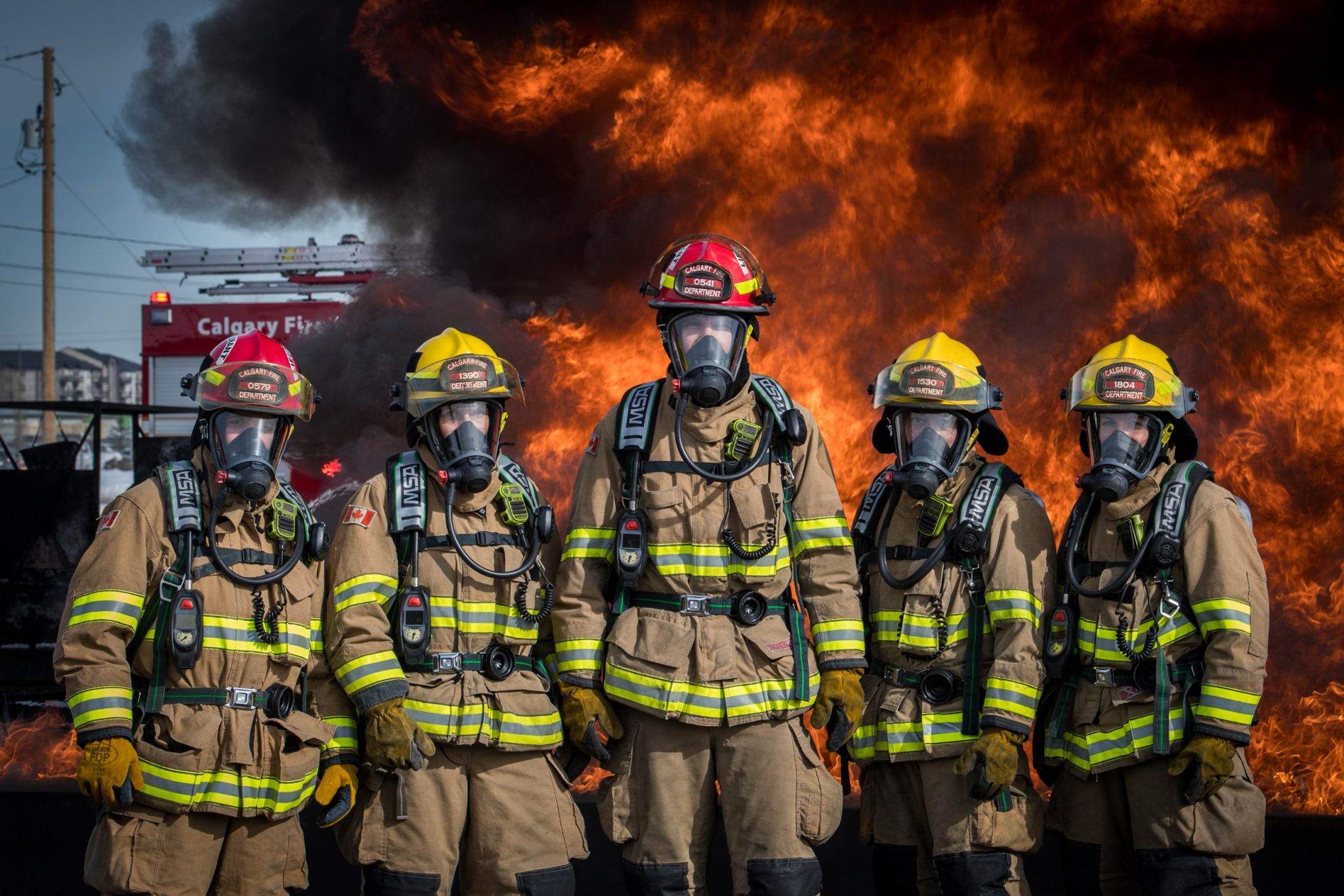 Firefighters in front of fire