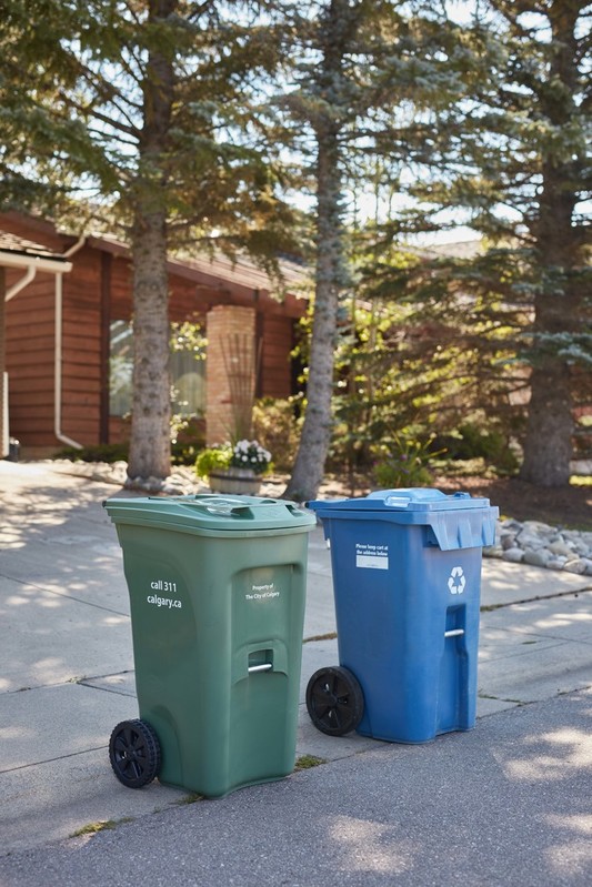 Waste & Recycling carts on road