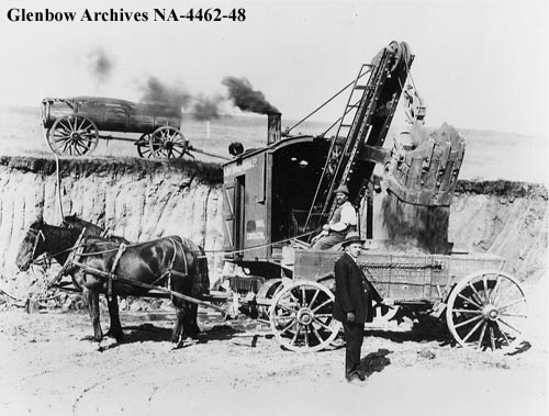 Image of worker of horse wagon doing construction