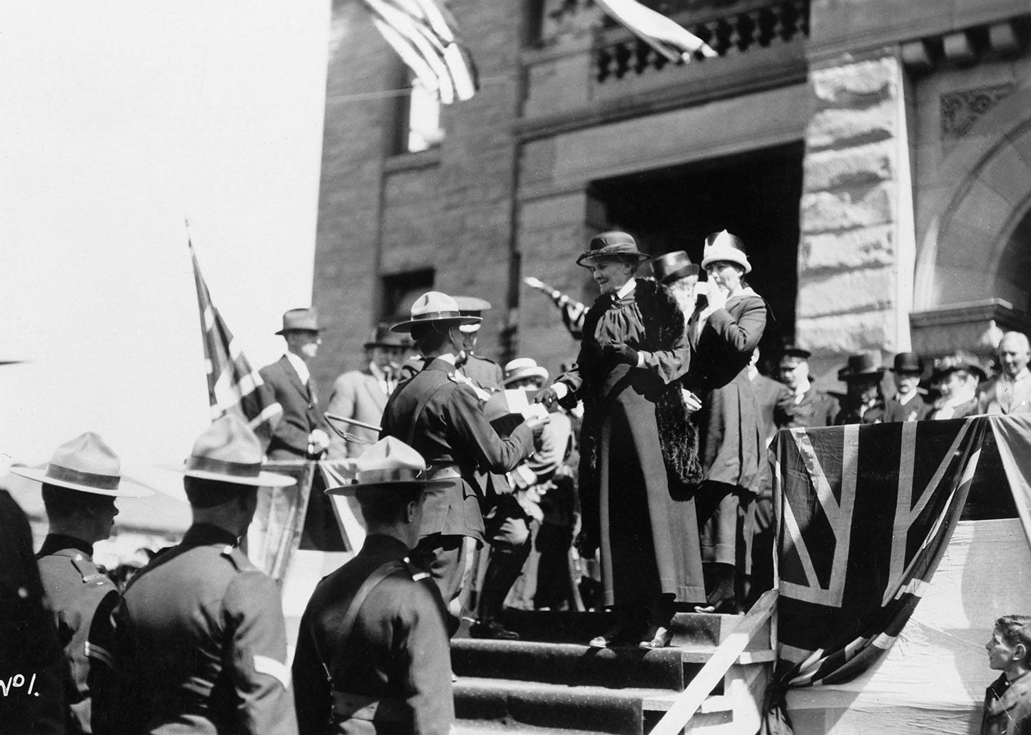 Mary Macleod with Mounted Police at an event at City Hall (undated).