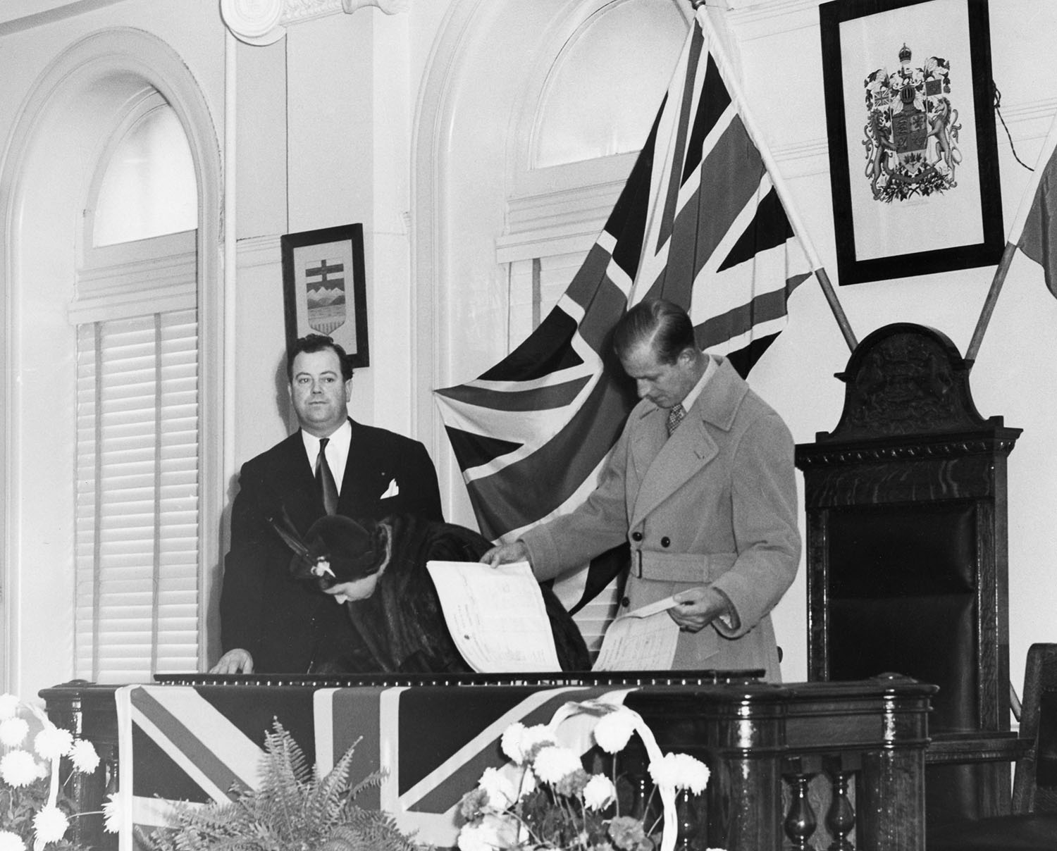 Prince Philip regards the guest register at Historic City Hall on October 18, 1951.