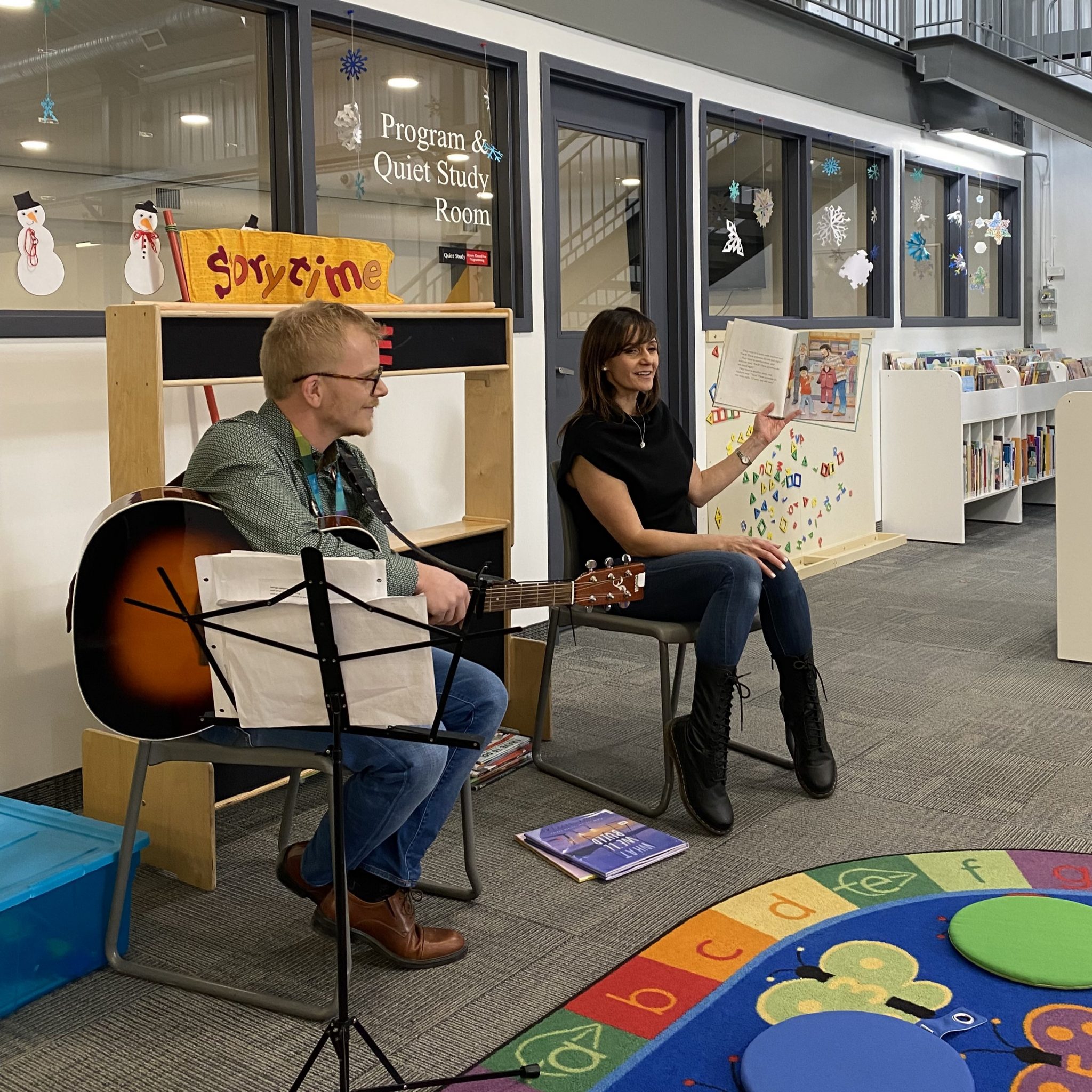 Councillor Sonya Sharp reading during story time at the Bowness Library