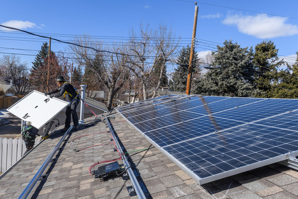 Solar panels being installed on a residential roof