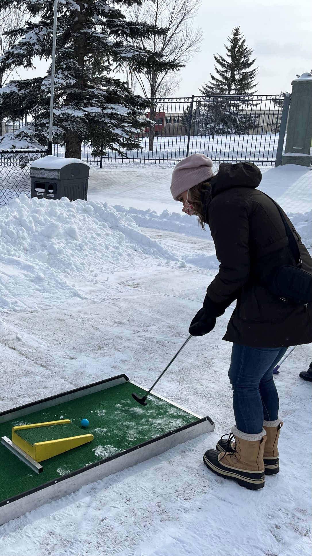 Councillor Sharp playing winter mini-golf