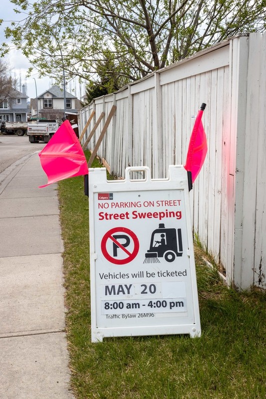 Street sweeping parking sign