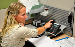 Calgary Police volunteer answering the phone.