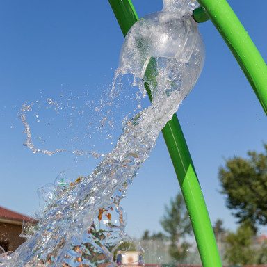 Water splashes at Prairie Winds Park spray park where Calgarians cool down in the hot summer