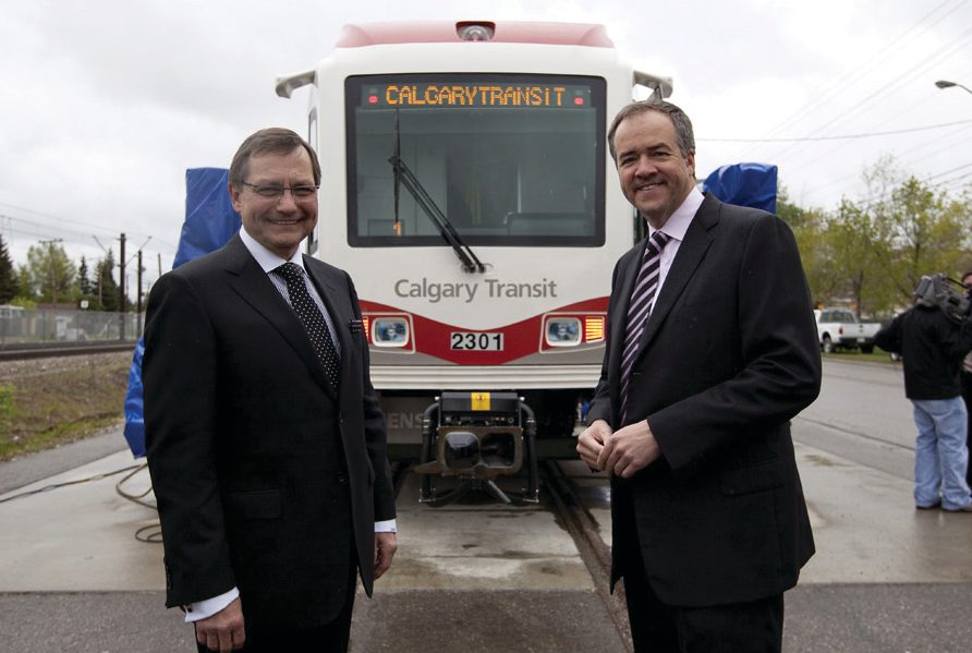 Mayor Dave Bronconier and Premier Ed Stelmach in front of the new Series 8 cars. (June 11, 2010)