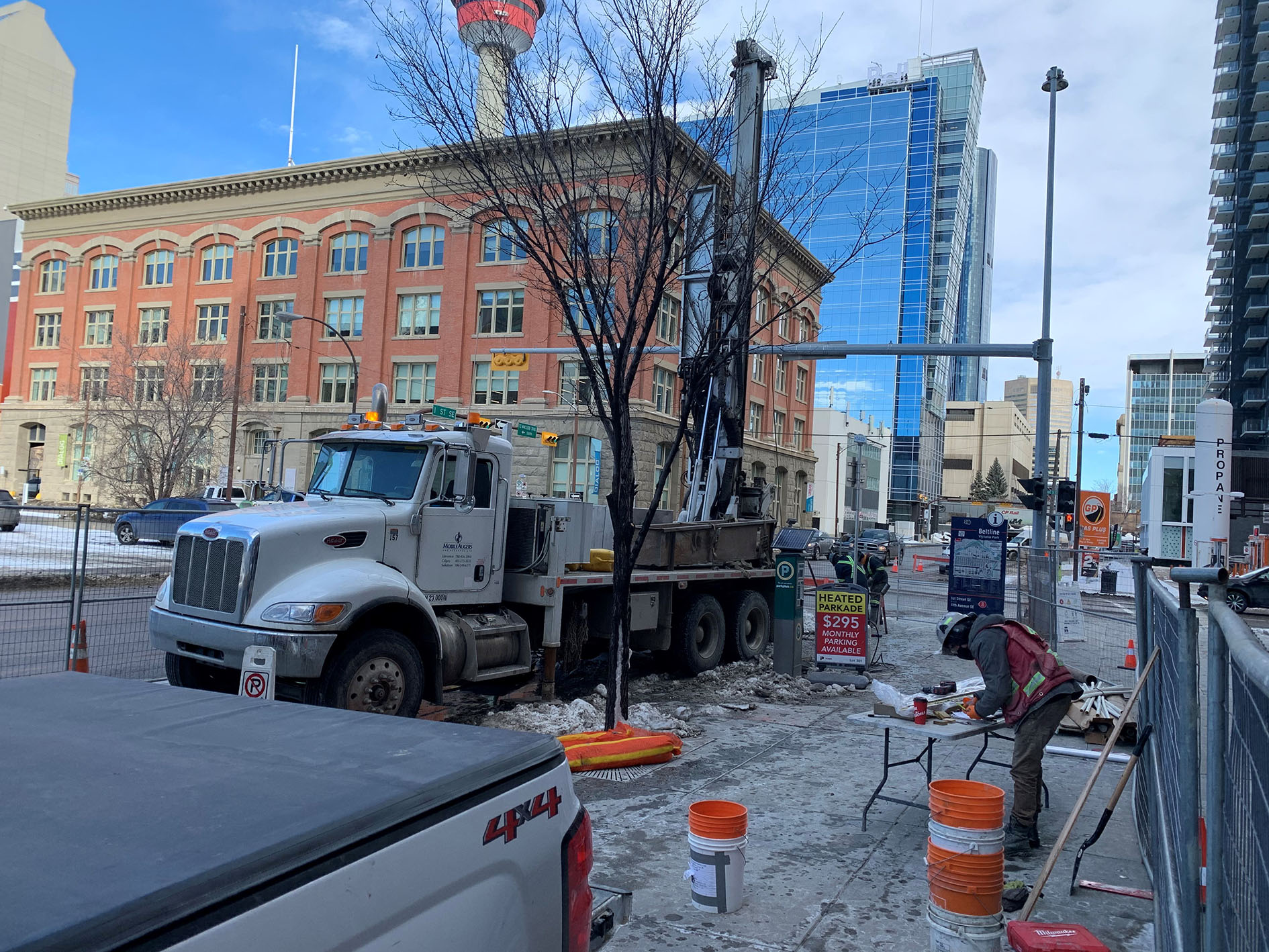 Geotechnical Drilling in Downtown Calgary to analyze underground conditions before construction begins.