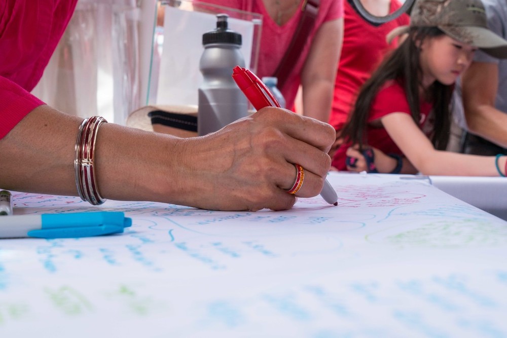 woman's hand signing