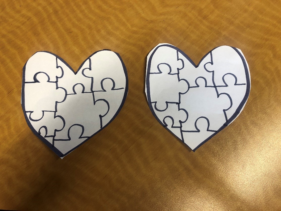 paper heart with puzzle pieces