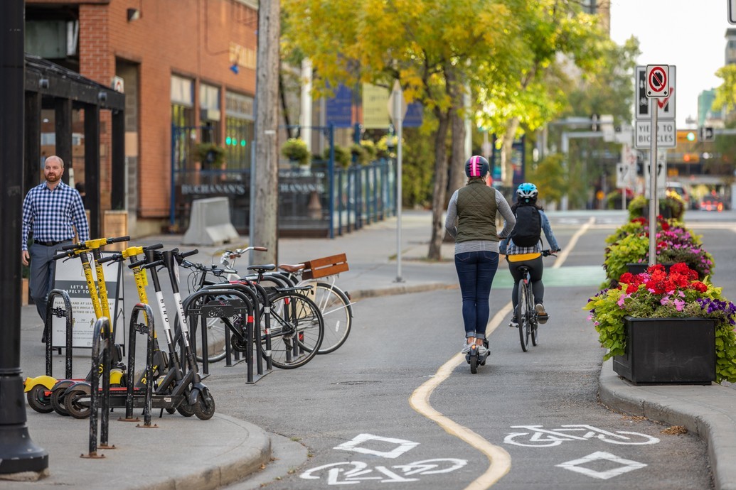 Two citizens are using bikeways in Calgary