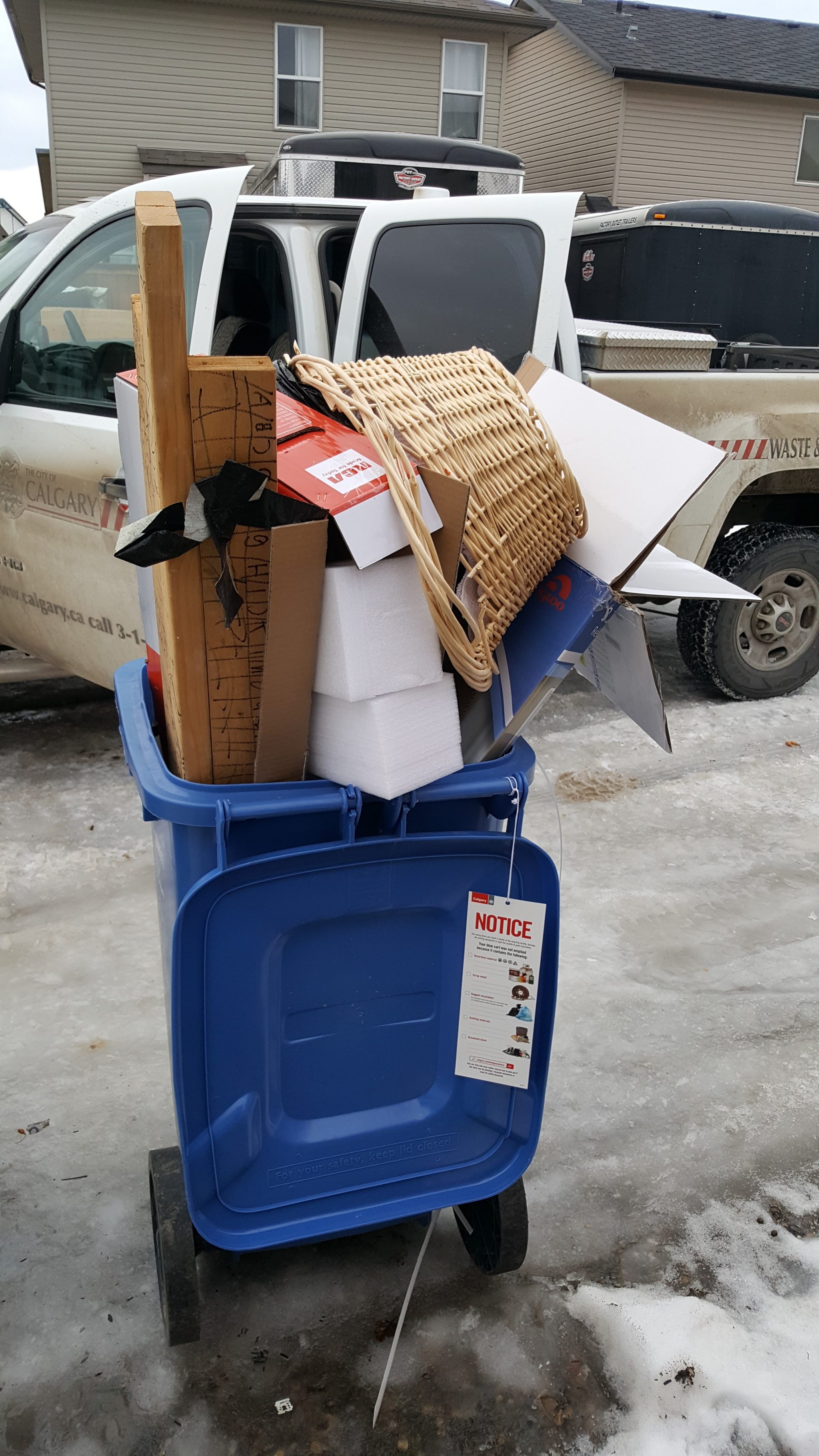 Green cart filled with household materials