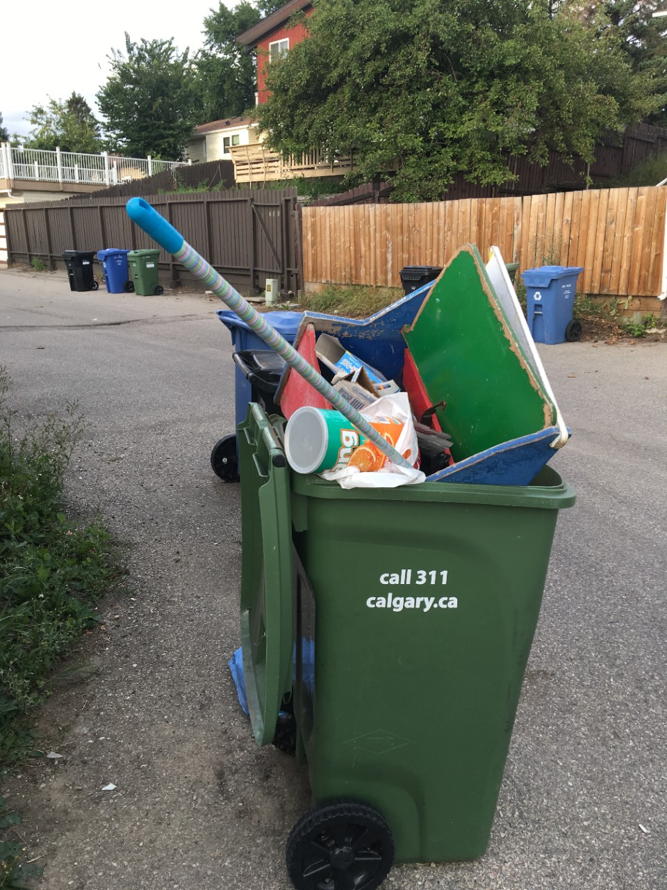 Green cart filled with household materials