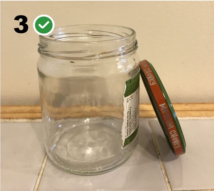 Clean salsa jar with lid removed.
